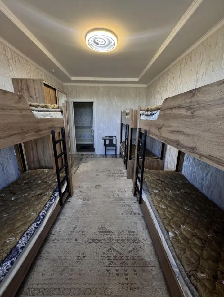 Bed in a male dormitory room — bed space, Karakol