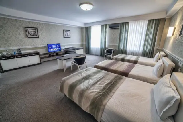 Deluxe Triple — room, Osh